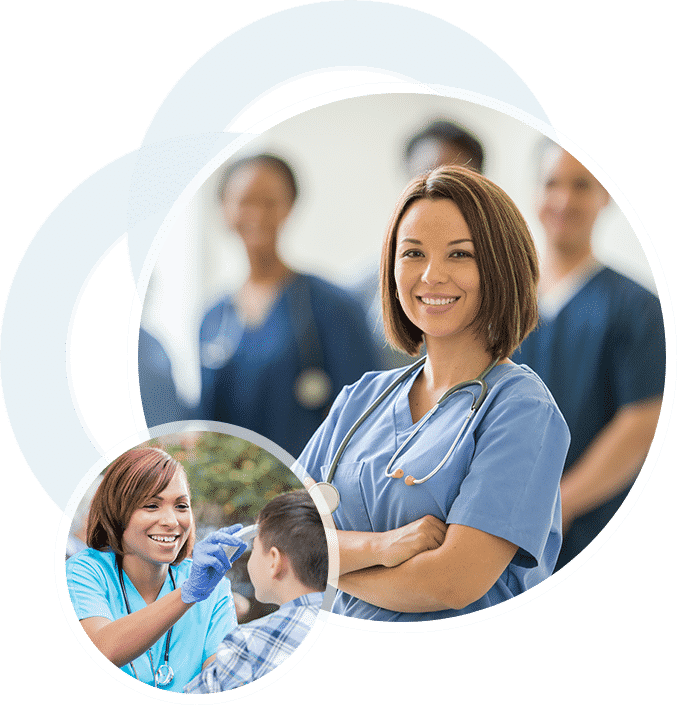 Two smiling women in nurse uniforms
